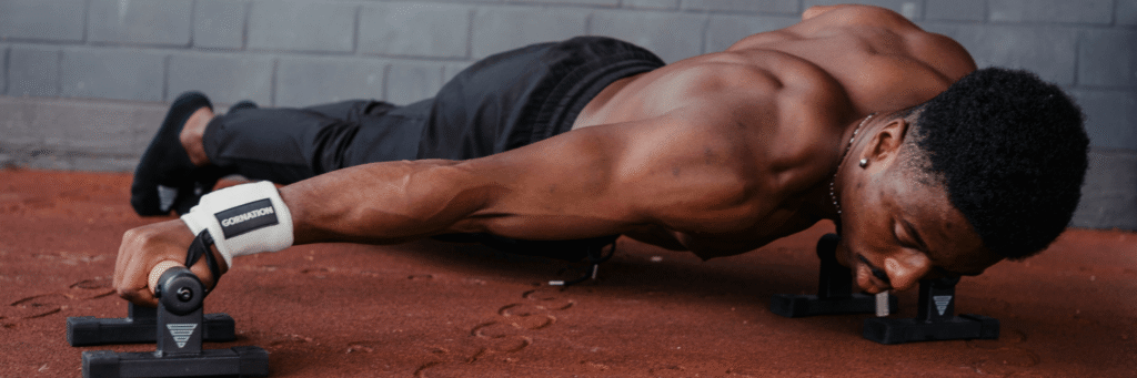 Why You Should Use Wrist Wraps in Calisthenics and Weight Training GORNATION athlete performs archer push ups with the GORNATION Power Wrist Wraps