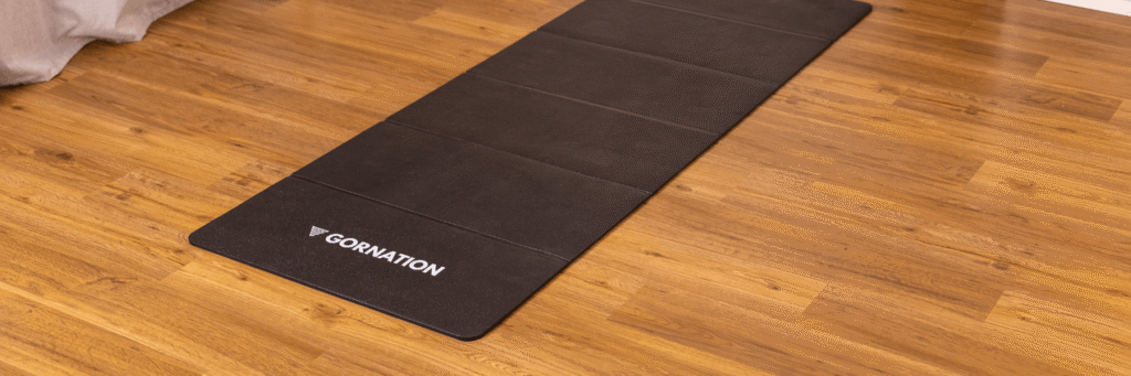 Foldable Mat Guide | The Perfect Workout Mat for Home & Calisthenics Training GORNATION Foldable Workout Mat laying in a living room