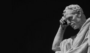 A statue of a man deep in thought.
